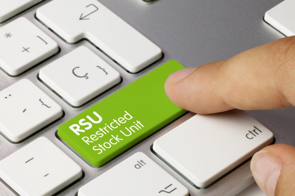 Computer Keyboard with one green key labeled RSU (Restricted Stock Units)